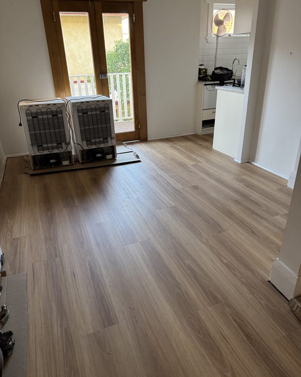 Warm timber-look plank laid through an open living area
