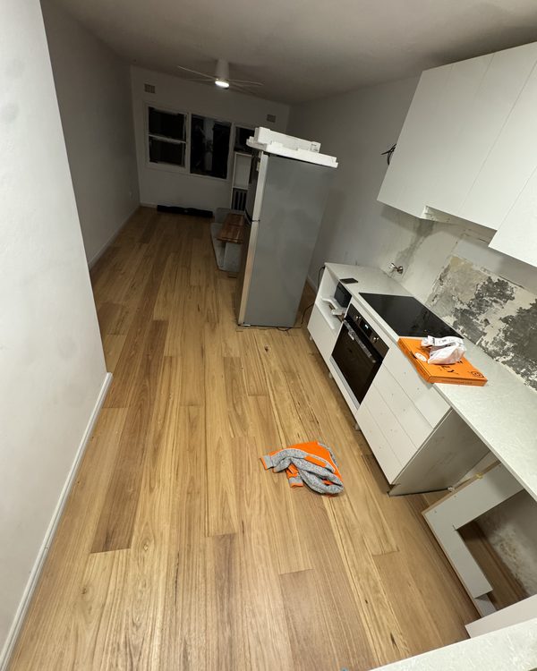 Timber flooring laid through a kitchen during a full renovation
