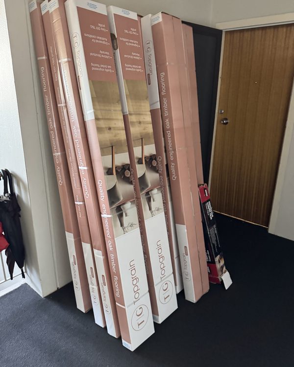 Boxes of engineered oak flooring delivered and stacked to acclimatise