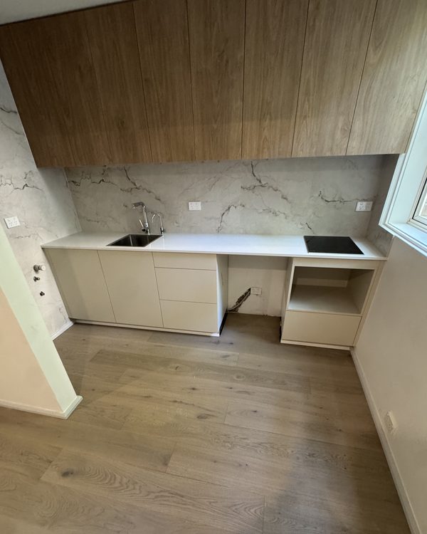 Light engineered oak meeting a marble kitchen and timber joinery